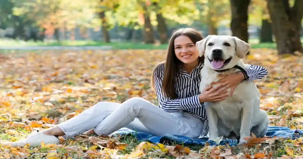 young woman hugging her dog 1