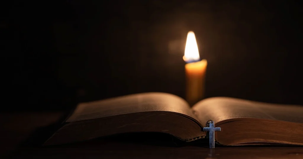 cross with bible candle old oak wooden table